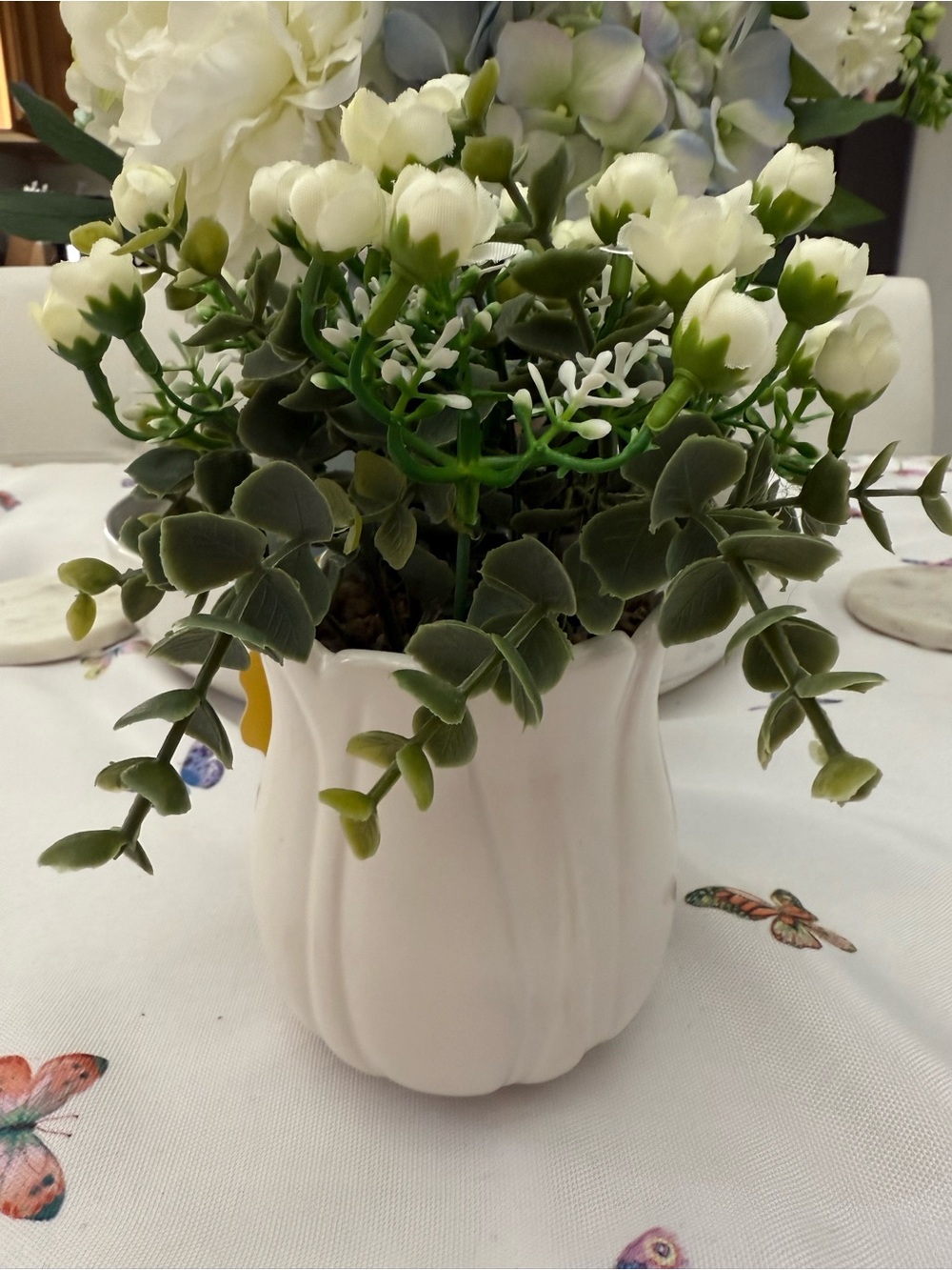 White Ceramic Vase with Green and White Faux Floral Arrangement